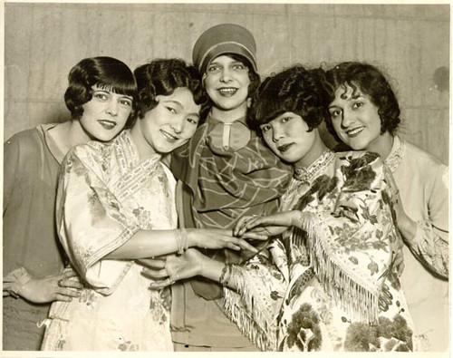 [Members of the cast of the musical comedy "Castles in the Air" visiting with members of the Fah Dang Wui committee in Chinatown]