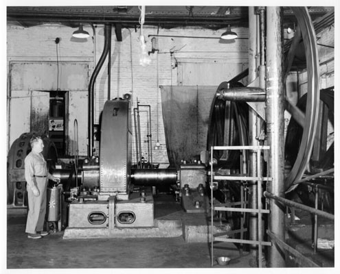 [Unidentified man working in the cable car barn at California and Hyde Streets]