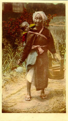 [Woman with child strapped to her back carrying a pot and an unidentified container]