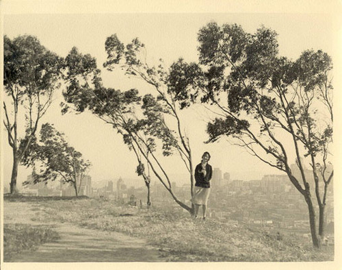 [Unidentified woman standing on Telegraph Hill]