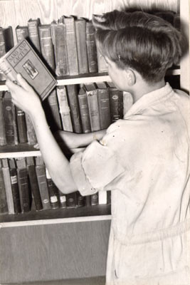 [Boy in library of the Juvenile Detention Home]