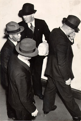 [Convict Frank E. Moten (left), during a trial of two other prisoners who made a failed escape attempt from Alcatraz Prison in May, 1938]