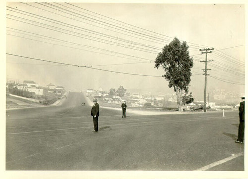 [Several men standing at the intersection of Third and Bayshore streets]