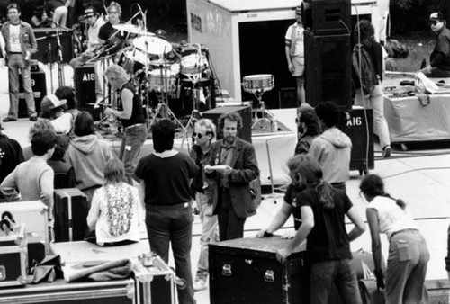 [Stage hands at work during concert in Golden Gate Park]