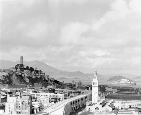 [View of Ferry Terminal and Embarcadero Freeway, with Telegraph Hill in background]