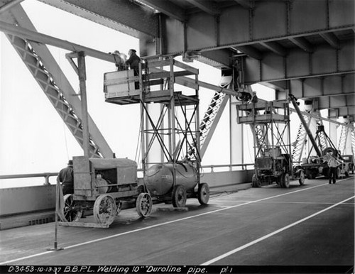 [Rows of welding towers allow construction workers to assemble Duroline pipe on Bay Bridge]