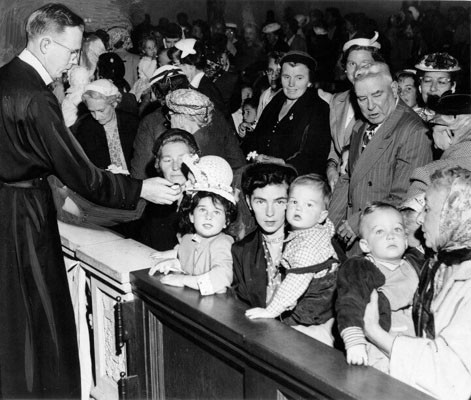 [Children being blessed at St. Anne's Church]