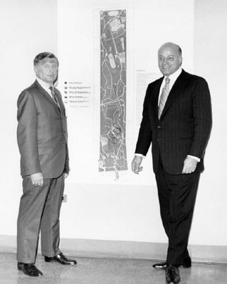 [Joseph Alioto (right) and unidentified man at the Golden Gate Park Centennial final membership meeting]