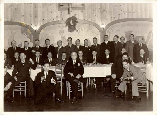 [Group of men posing for a picture in a restaurant in Visitacion Valley]