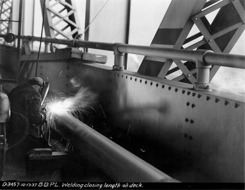 [Bay Bridge welder at work on pipeline]