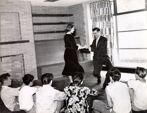 [Arthur Murray dance instructors teaching a class of boys at the Youth Guidance Center]