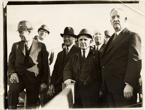 [Joseph B. Strauss, engineer (center) with a group of unidentified people]