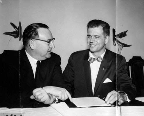 [Edmund G. ("Pat") Brown (left) greets Michigan Governor G. Mennen Williams]