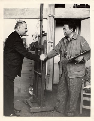 [Mexican artist Diego Rivera shaking hands with Timothy Pflueger]