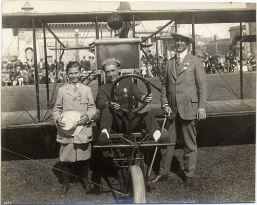 [Art Smith in his aeroplane in front of the Canadian Pacific Railroad Building at the Panama Pacific International Exposition]