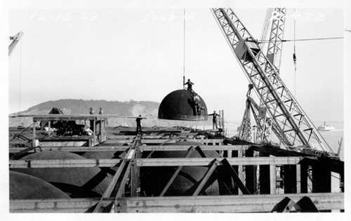 [Workers preparing a caisson used during construction of the San Francisco-Oakland Bay Bridge]