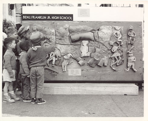 [Children pointing at relief art work belonging to Benjamin Franklin Junior High School]