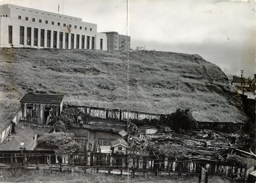 [Wrecking crew destroying squatters' homes on the U. S. Mint property at Market, Buchanan and Duboce streets]