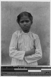 Portrait of a girl wearing a patterned shirt, India, ca. 1914