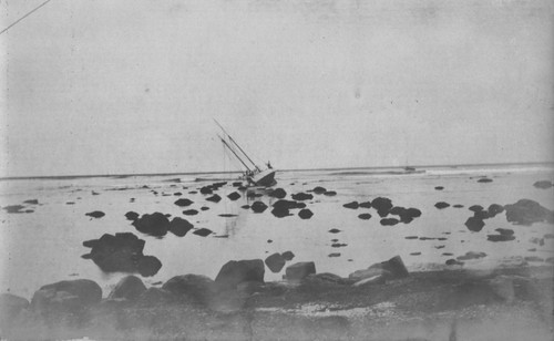 The "Loma" given to the Marine Biological Association of San Diego by E.W. Scripps for research purposes shown here run aground near the Point Loma lighthouse on July 25, 1906. The boat was caught by the breakers and carried up onto the rocky ledge that juts out from the point. When she could not be rescued everything was taken off the boat, including the copper sheathing and four tons of lead from the keel and she was abandon. The Association became the Scripps Institution of Oceanography. July 25, 1906