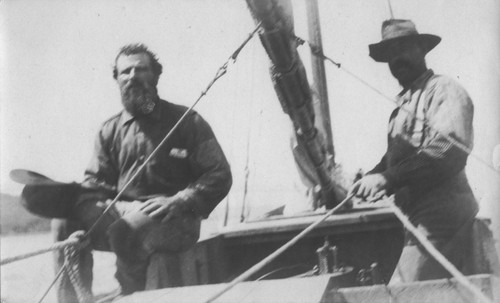 Manual Cabral (left) with an unidentified man, both working on the salvage process of the Loma. The "Loma" was given to the Marine Biological Association of San Diego by E.W. Scripps for research purposes she ran aground near the lighthouse on Point Loma on July 25, 1906. Cabral was a Portuguese fisherman who worked for the Marine Biological Association to captain rented schooners and boats for the association during research ventures. The Association became the Scripps Institution of Oceanography. July 25, 1906