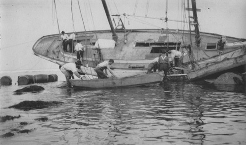 Robert H. Baker, Manuel Cabral and others working on the salvage of the wreck of the "Loma" given to the Marine Biological Association of San Diego by E.W. Scripps for research purposes; it ran aground near the lighthouse on Point Loma on July 25, 1906. The Association became the Scripps Institution of Oceanography. July 25, 1906