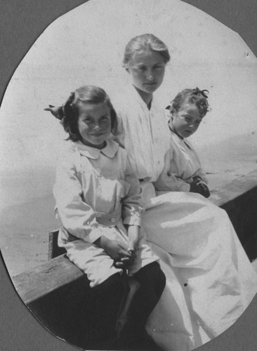 Woman and two children at the seashore