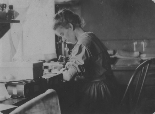 [Woman at microscope]