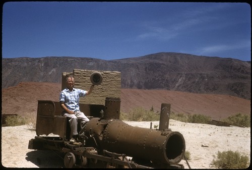 Howard E. Gulick on old locomotive at Las Flores