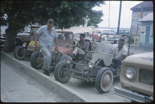 Bud Dugeau, Howard Hayford, Les Hazerot, and Bill Rawls with dune buggies, La Paz
