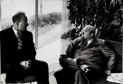 Leo Szilard with visitor in the Dupont Plaza Hotel lobby; Washington, DC - 1