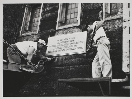 Birthplace of the atomic age ceremony: workers removing plaque