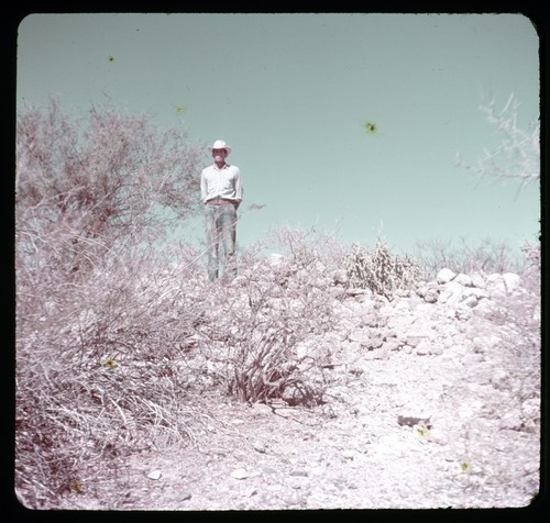 Man with ruins of Misión San Bruno