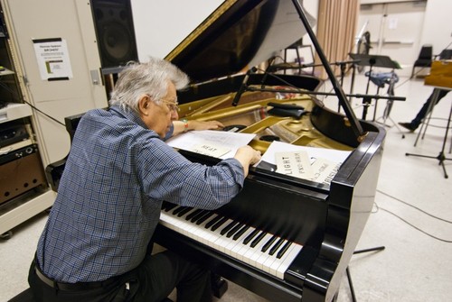 Ping: Rehearsal for 2011 UC San Diego performance: Reynolds at piano with score page and cue cards