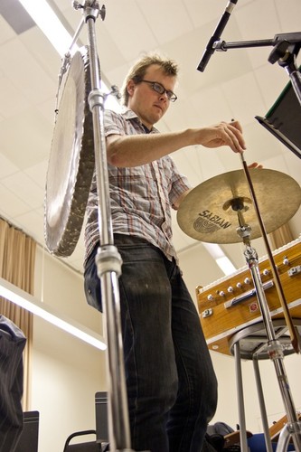 Ping: Rehearsal for 2011 UC San Diego performance: Ross Karre bowing cymbal, as described in period image