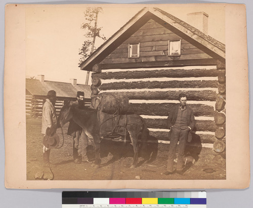 [Mule packed with pork barrels. Mssrs. Lord and Bauerman and muleteer at Colville.]