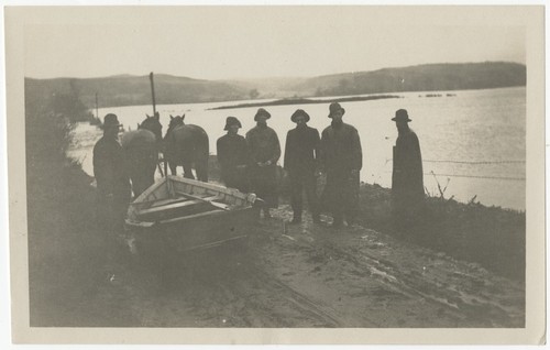 Men and horses preparing for a rescue by the swollen San Dieguito River