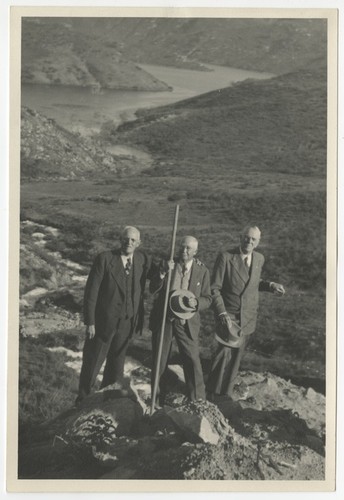 Ed Fletcher, Ed Hodge and G. Aubrey Davidson celebrating the first Colorado River water to reach San Vicente Lake, San Diego County