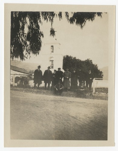 People in front of the bell tower at Pala Mission