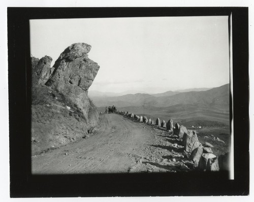 People overlooking valley