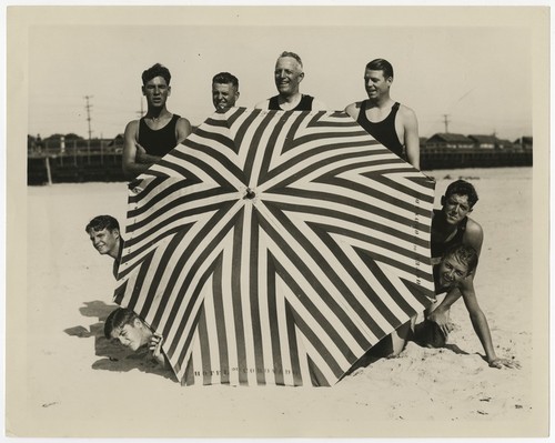 Fletcher family swim team with umbrella