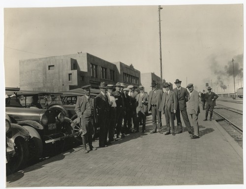 Ed Fletcher with group of men at train station