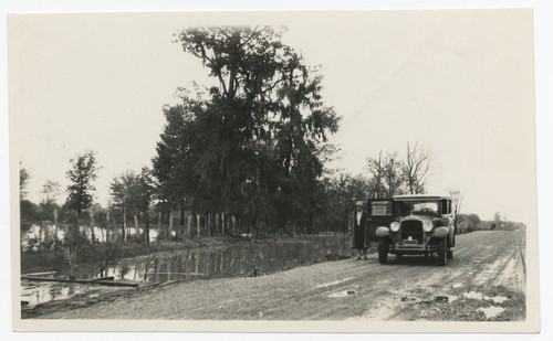 Mary Fletcher next to flooded field