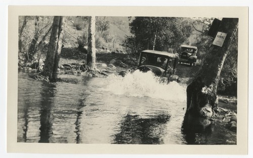 Automobiles crossing Boulder Creek, San Diego County