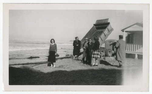 Mary, Lilian, Lila, and Joan Fletcher at beach with dump truck