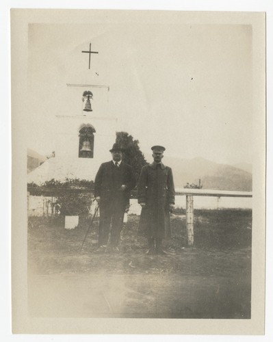 Men in front of the bell tower at Pala Mission