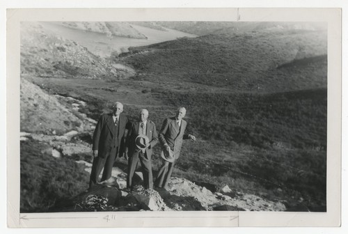 Ed Fletcher, Ed Hodge and G. Aubrey Davidson celebrating the first Colorado River water to reach San Vicente Lake, San Diego County