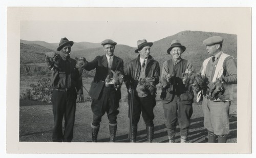 Men posing with birds on hunting trip to Baja California