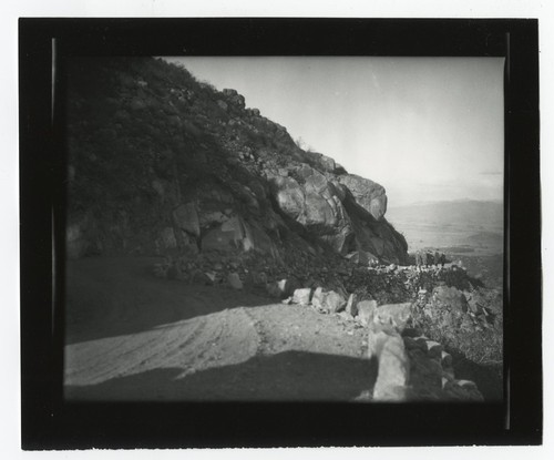 People overlooking valley