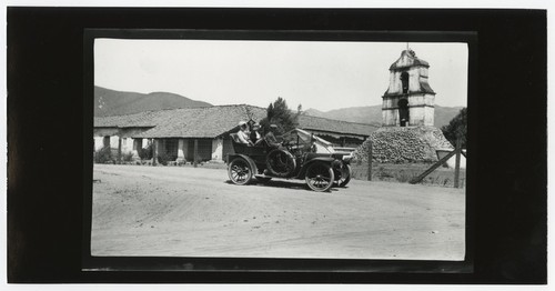 People in front of the bell tower at Pala Mission